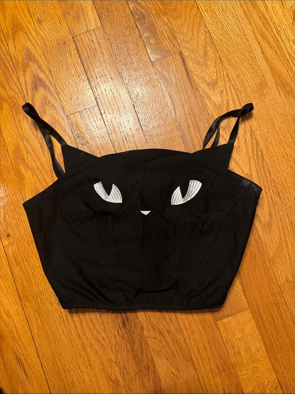 Dolls Kill Black Cat-Eye Crop Top with White Embroidered Detail